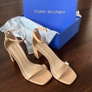 Stuart Weitzman "Nudistcurve" sandals in patent calf leather